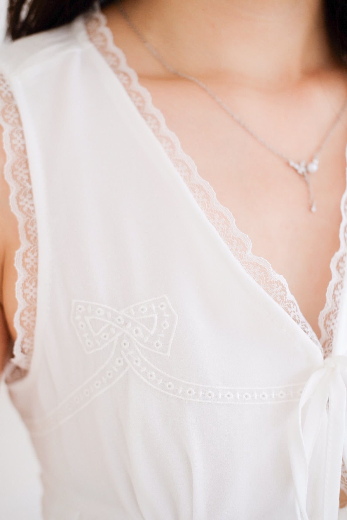 Yanice Ruffle Ribbon Vest Top (White)